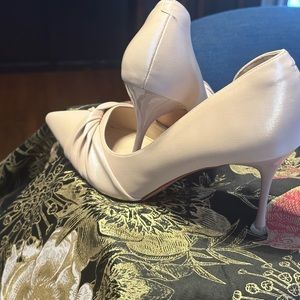 Cream tint high heels with a crystal like heel tap.